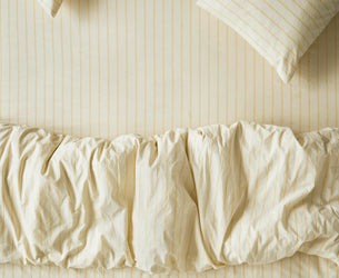 Close up Butter Yellow Slumber Stripe Bedding