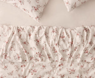Floral pillowcases and duvet cover on a plain pearl fitted sheet 