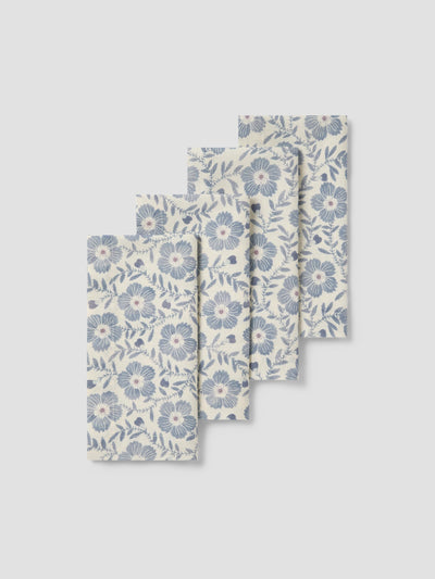 Set of three floral-patterned napkins on a light gray background