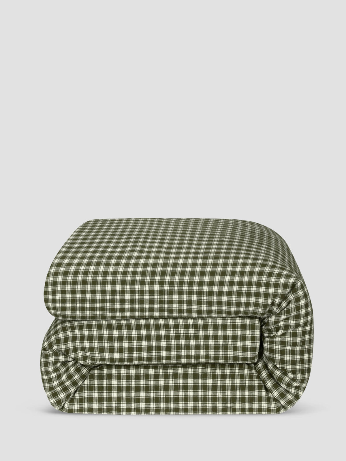 A folded green and white gingham checkered comforter, shown against a solid light gray background.
