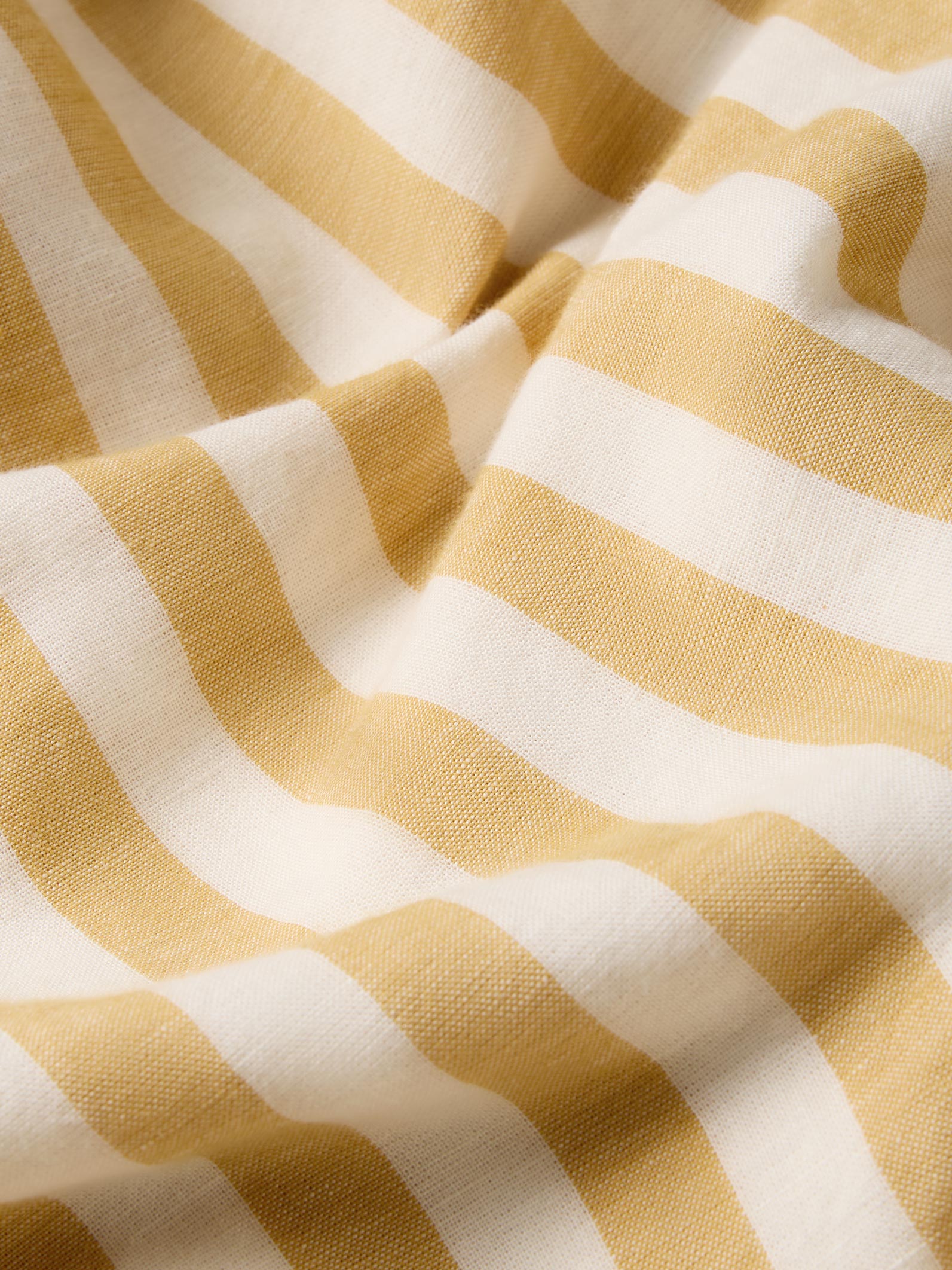 Close-up of yellow and white striped fabric