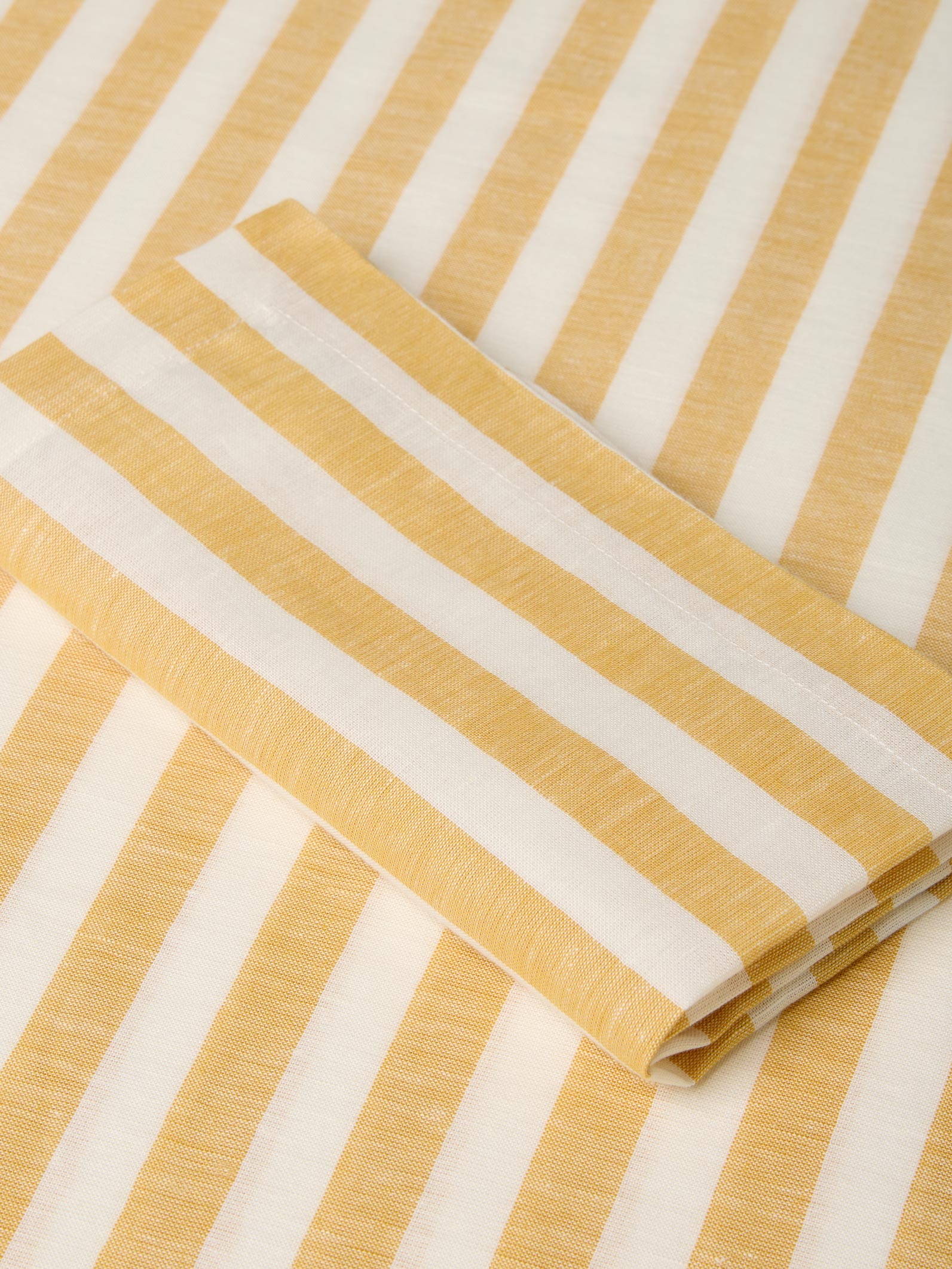 Close-up of yellow and white striped fabric