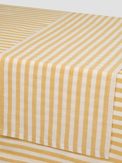 Yellow and white striped fabric on a white background