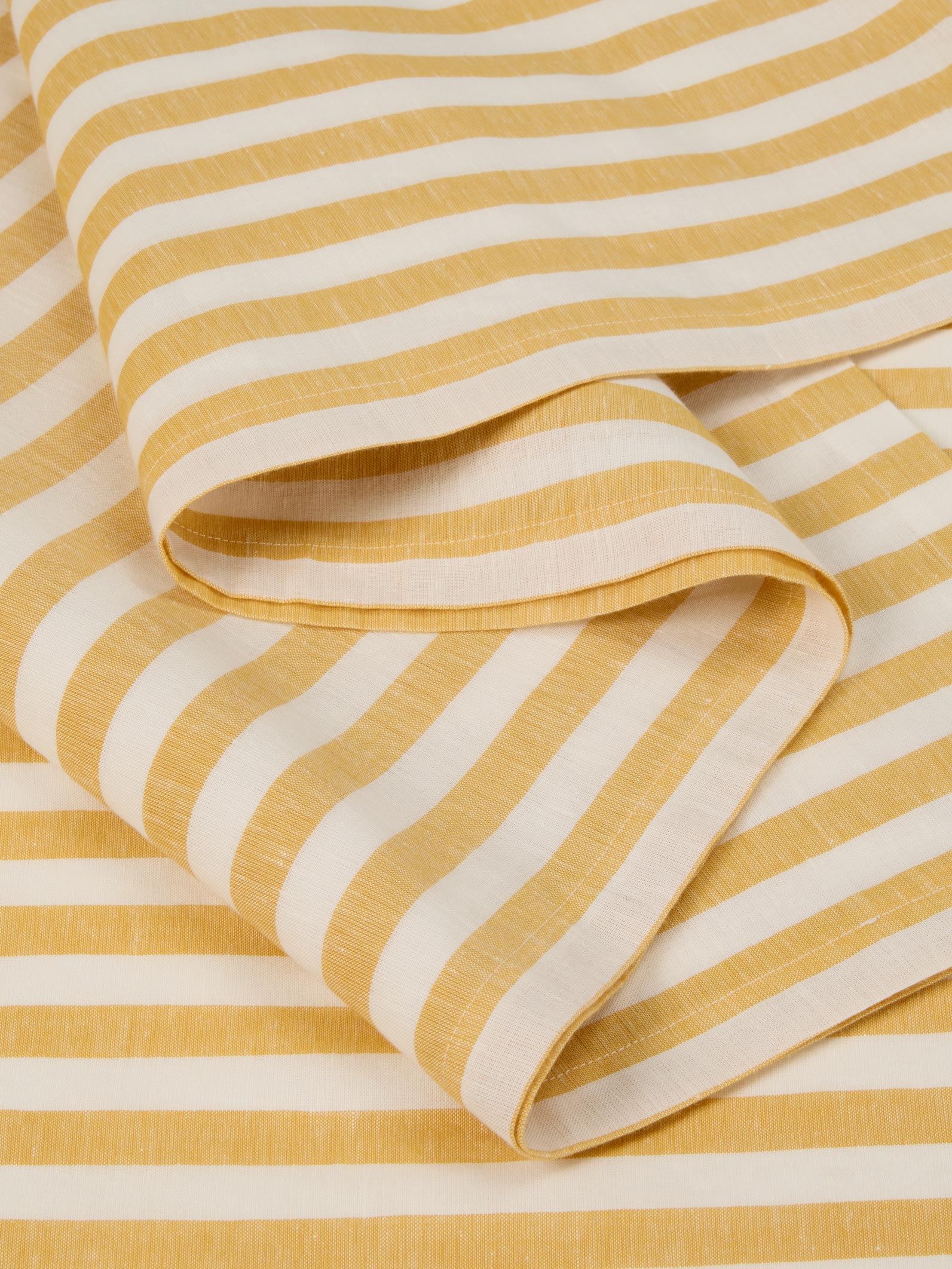 Close-up of yellow and white striped fabric