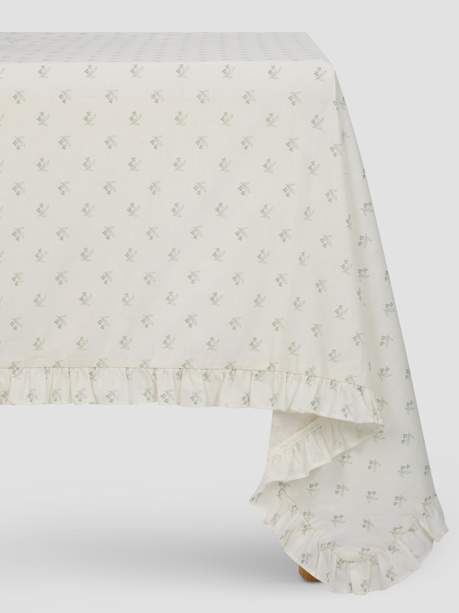 White tablecloth with subtle floral pattern on a white background