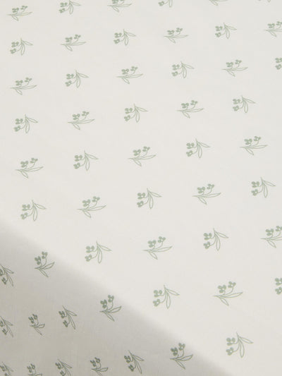 Pattern of small green leaves on a white background