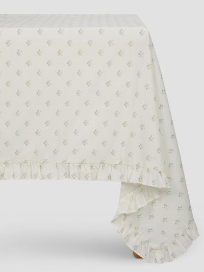 White tablecloth with subtle floral pattern on a white background