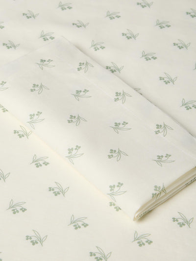 White fabric with green floral pattern