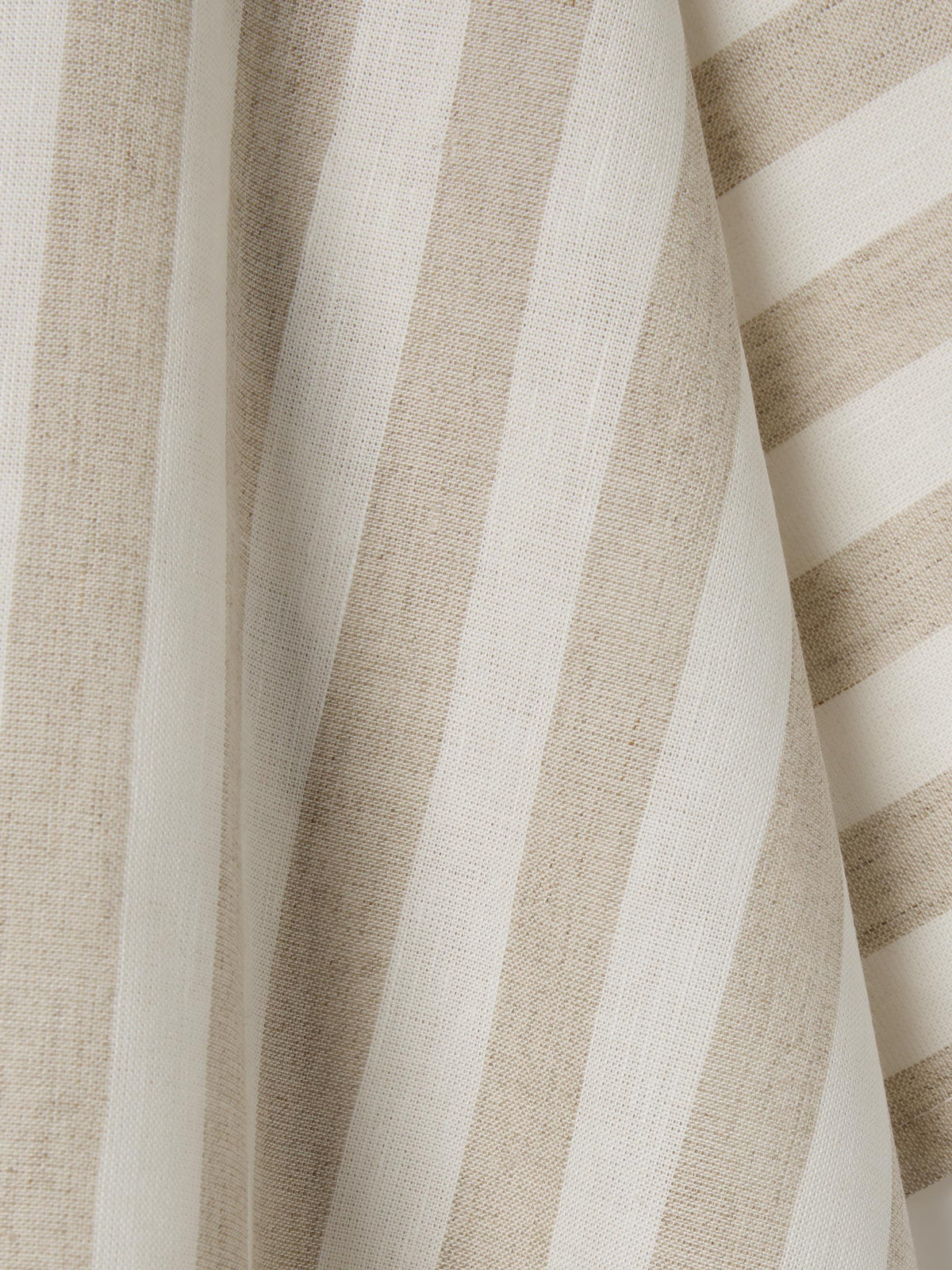 Close up of oatmeal and white striped material.