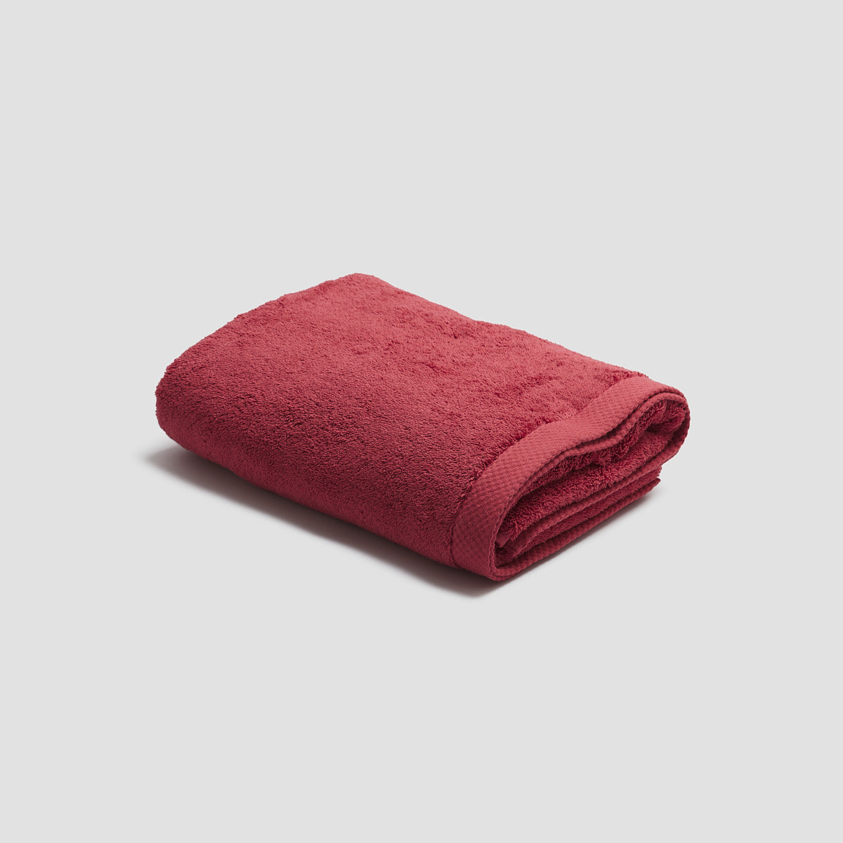 https://us.pigletinbed.com/cdn/shop/files/PigletinBed-BathroomCollection-OrganicCottonBathTowel-MineralRed-1_GreyBG.jpg?v=1688140152&width=1946