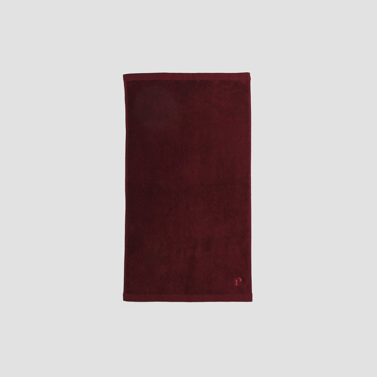 https://us.pigletinbed.com/cdn/shop/files/PigletinBed-BathroomCollection-OrganicCottonHandTowel-Merlot-2_GreyBG.jpg?v=1688139482&width=1946