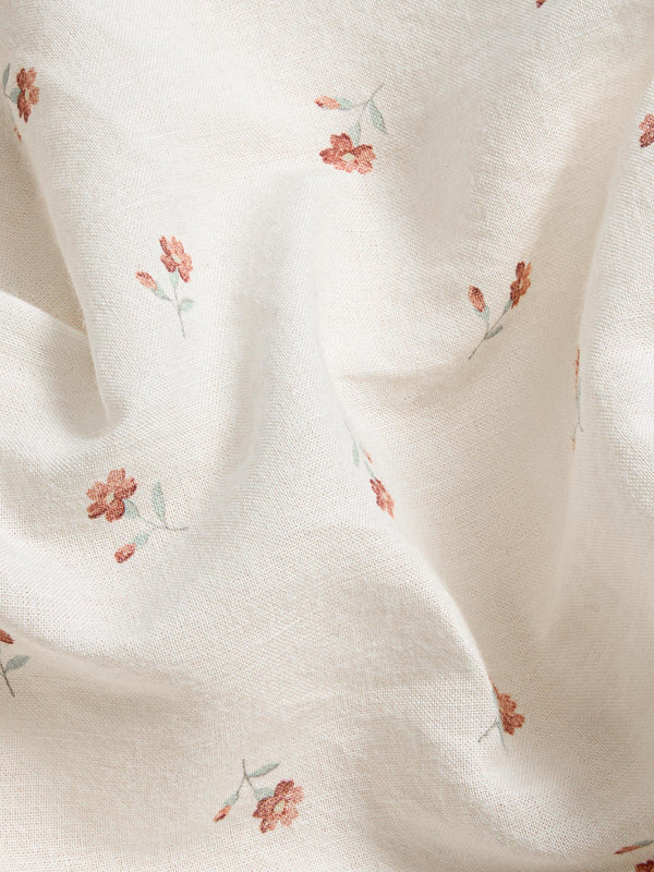 Floral pattern on a textured fabric surface