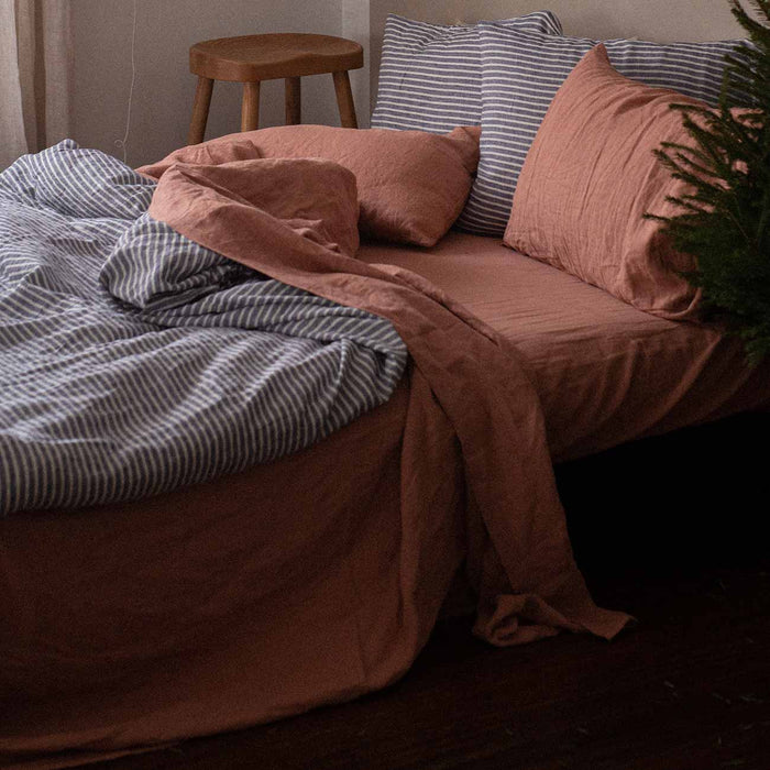 Warm Clay Flat and Fitted Sheets with Midnight Stripe Bedding